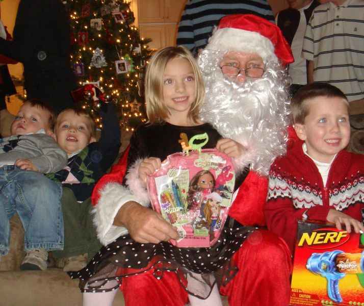 The Kids and Santa Enjoying His Visit