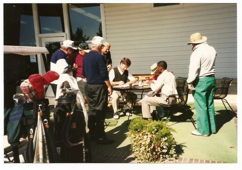 1997 TDL--Ewing crunching the numbers after 18 holes